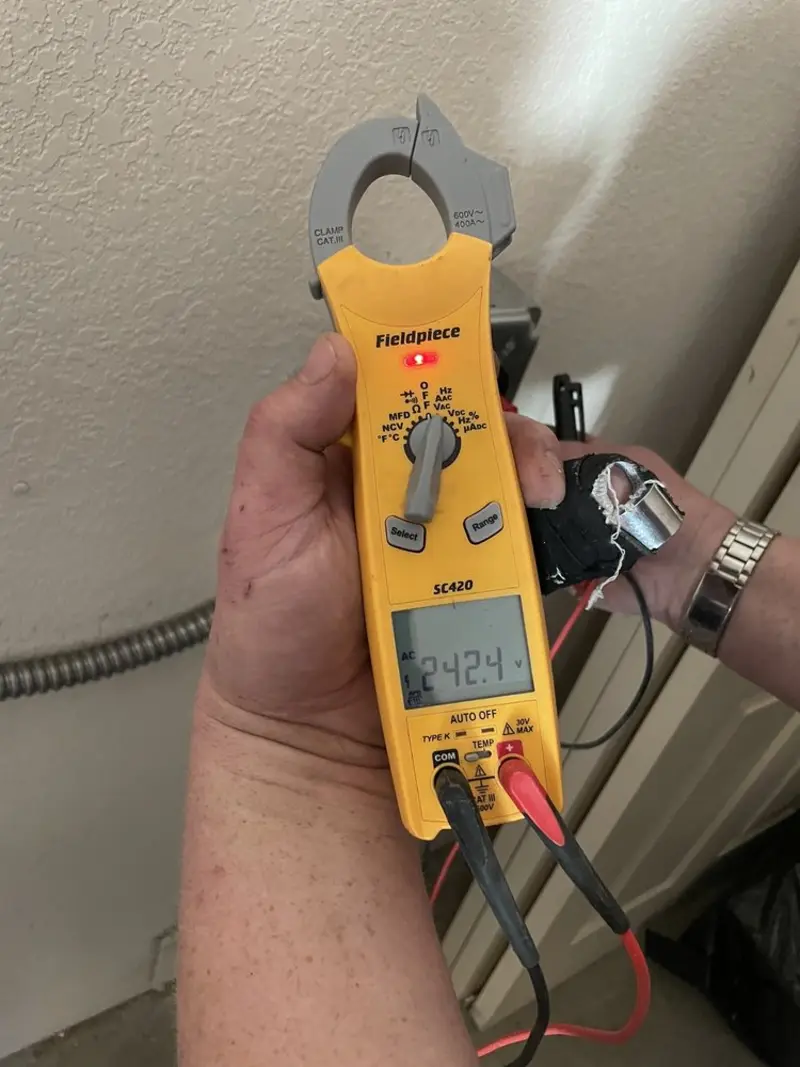 Voltage testing with clamp meter during Electrical Installation Services in Derby